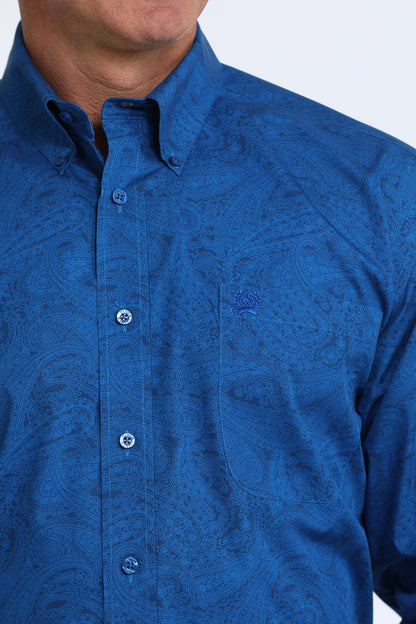 man wearing a blue Cinch shirt  on a white background