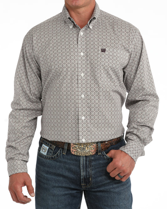 man wearing a Cinch shirt and blue jeans on a white background