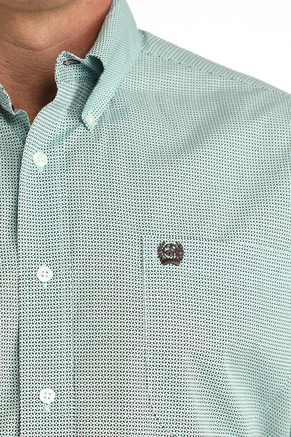 Close-up of a light blue 'Cinch' shirt with a small logo on the chest.