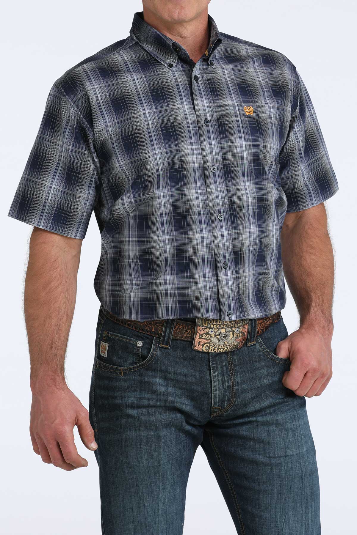 Man wearing a plaid shirt and jeans on a white background