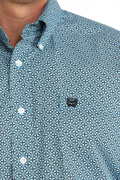 man wearing a blue patterned Cinch shirt on a white background