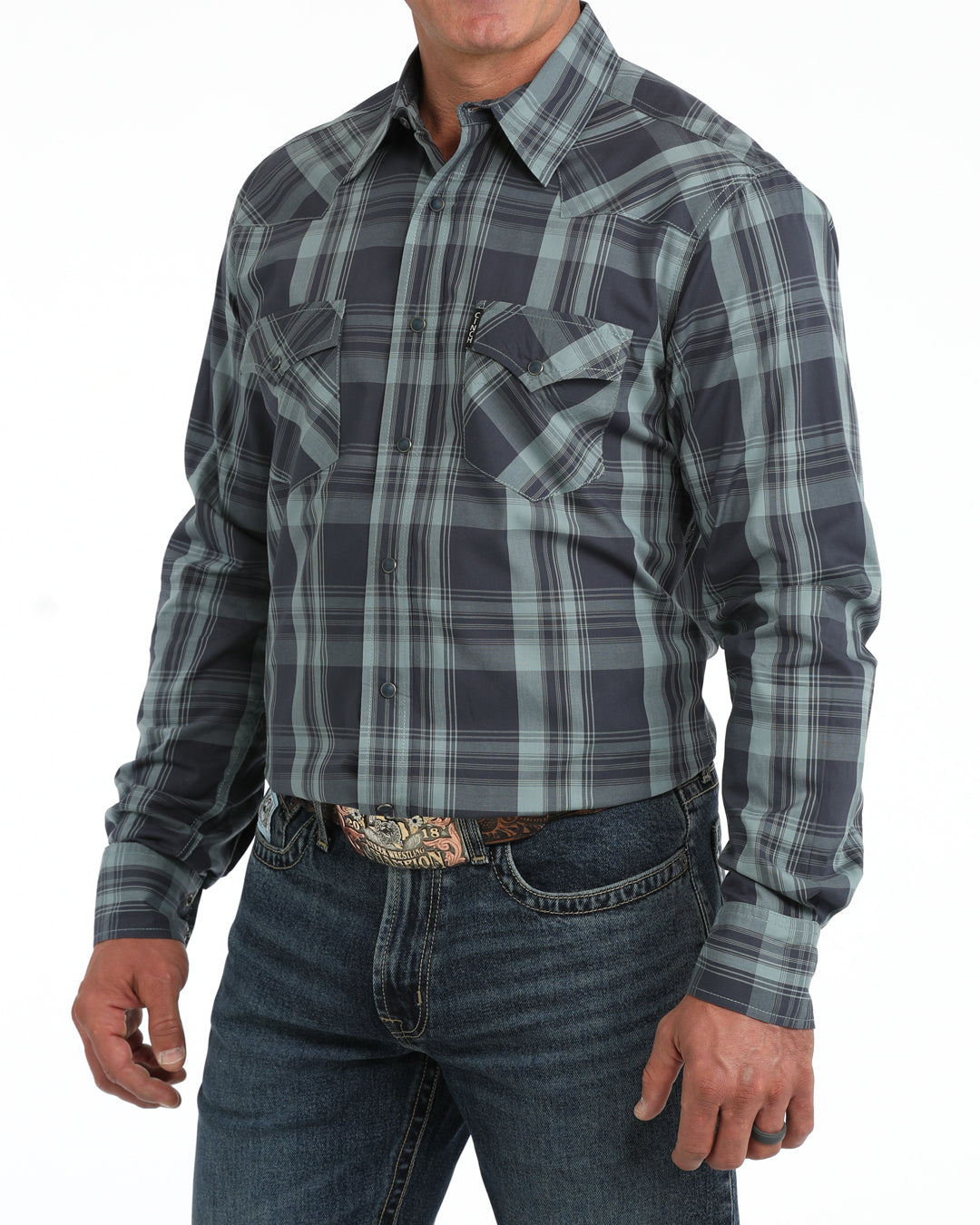 man wearing a blue plaid Cinch shirt and blue jeans on a white background
