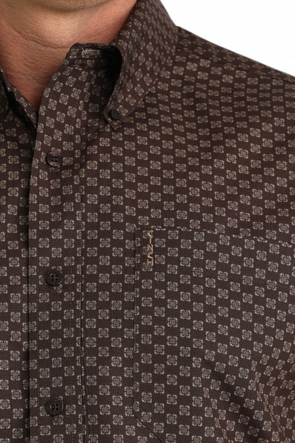 Close-up of a brown patterned 'Cinch' shirt with a collar.