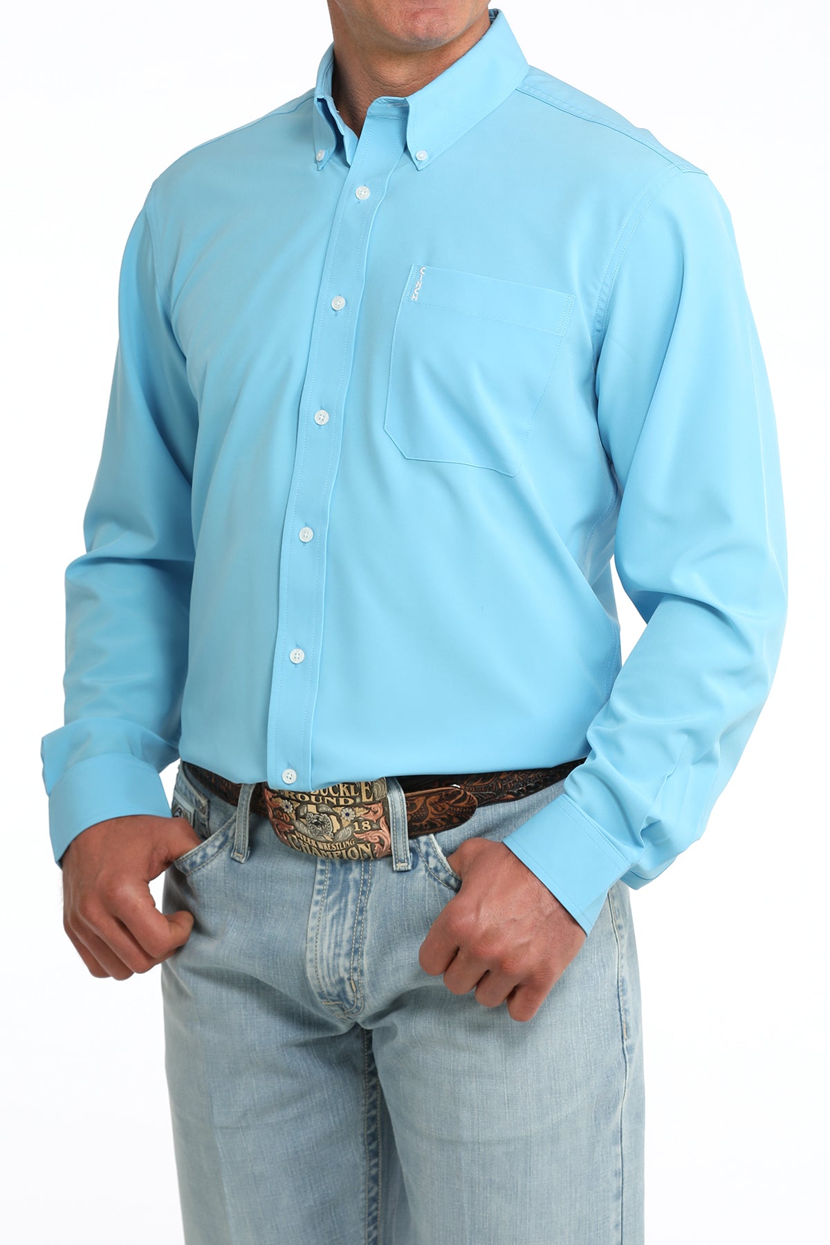 man wearing a blue Cinch shirt and blue jeans on a white background