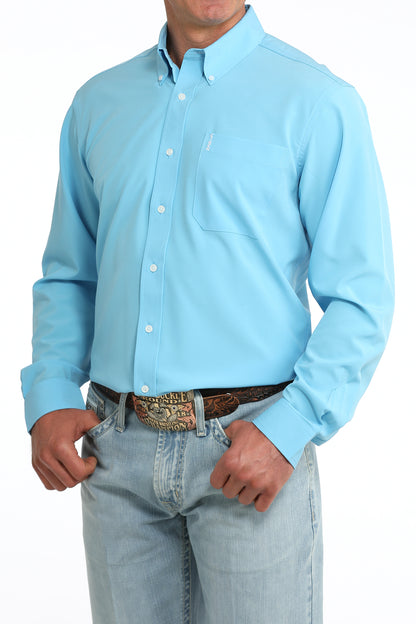 man wearing a blue Cinch shirt and blue jeans on a white background