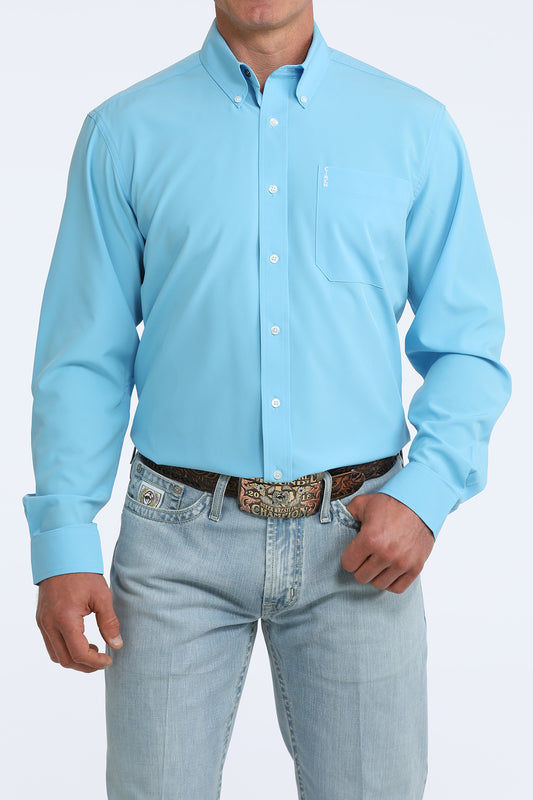 man wearing a blue Cinch shirt and blue jeans on a white background