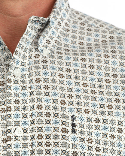 man wearing a cream floral Cinch shirt on a white background