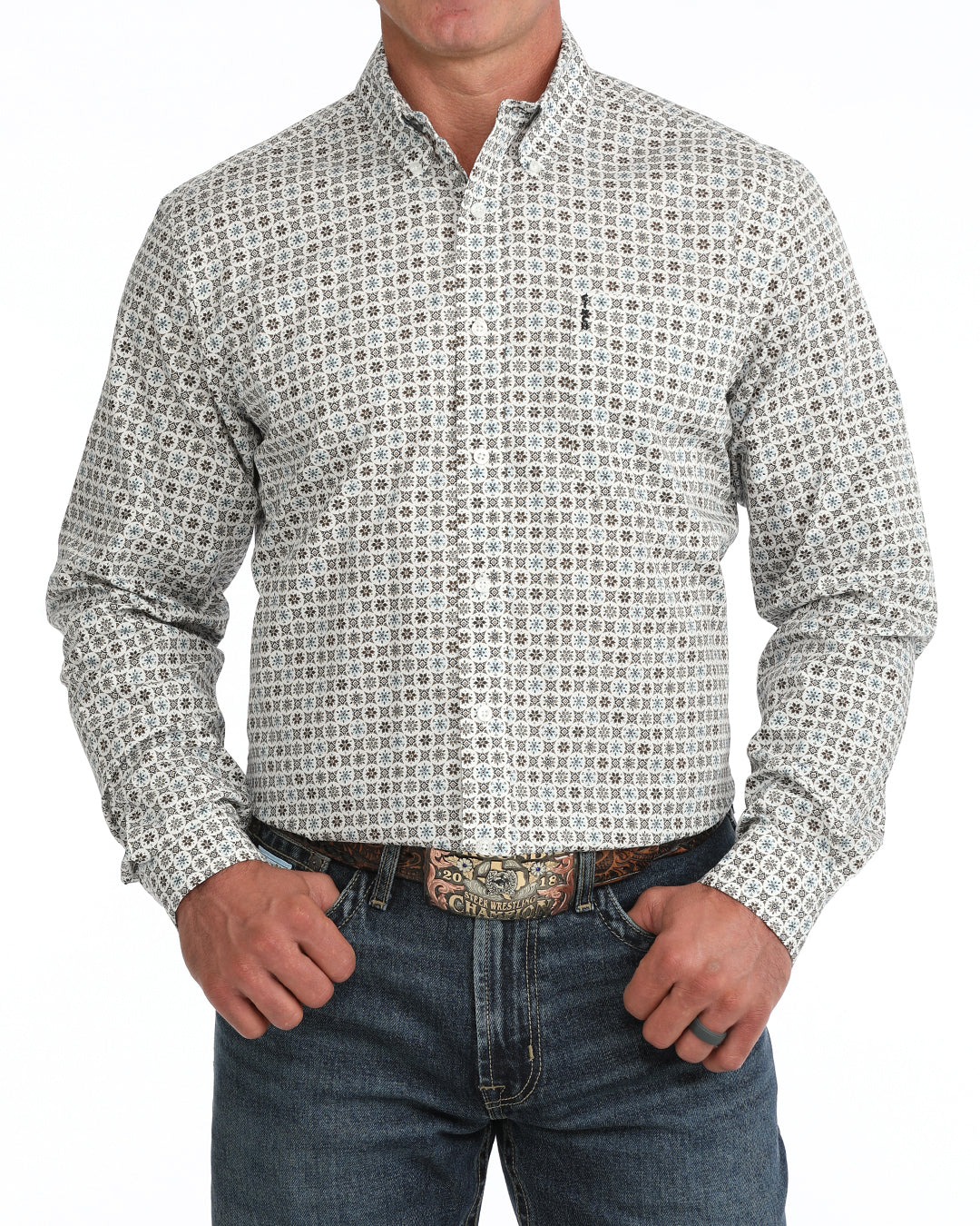 man wearing a cream floral print Cinch shirt and blue jeans on a white background