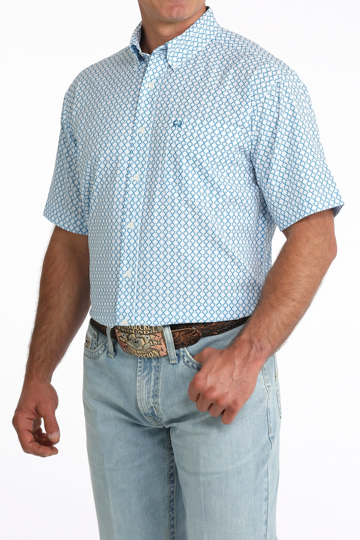man wearing a blue printed shirt and blue jeans on a white background