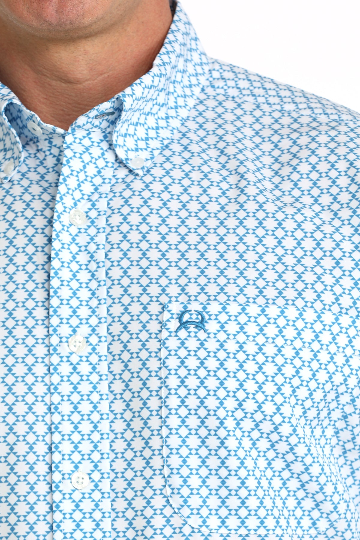 man wearing a blue printed shirt  on a white background