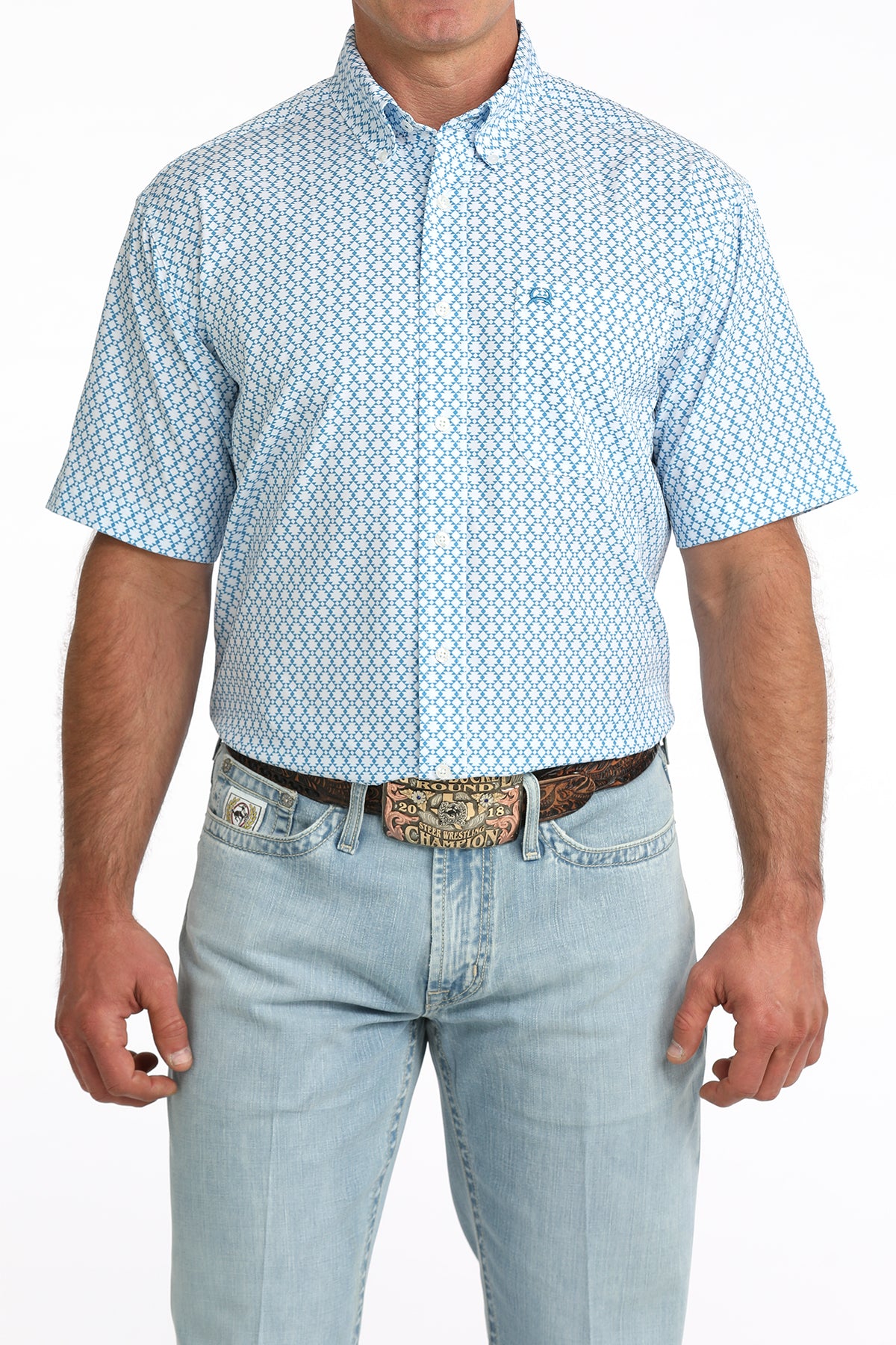 man wearing a blue printed shirt and blue jeans on a white background