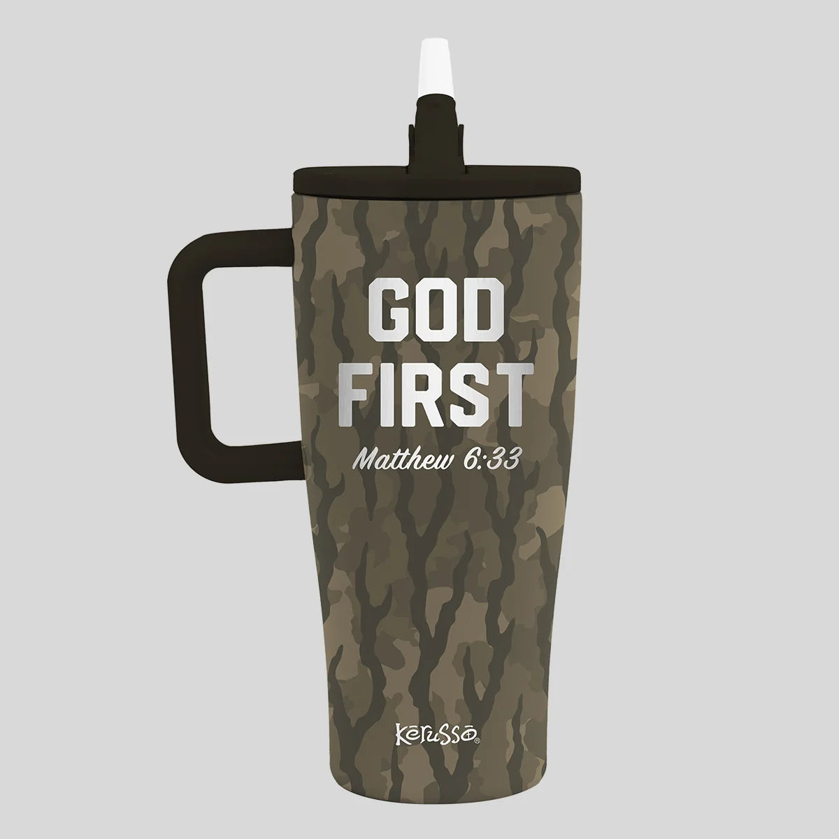 A tall insulated tumbler from Kerusso with a black handle and black lid, featuring a brown and green camouflage pattern. The front has the text 'GOD FIRST Matthew 6:33' in white, with the brand name 'keinsse' near the bottom, set against a solid gray background.