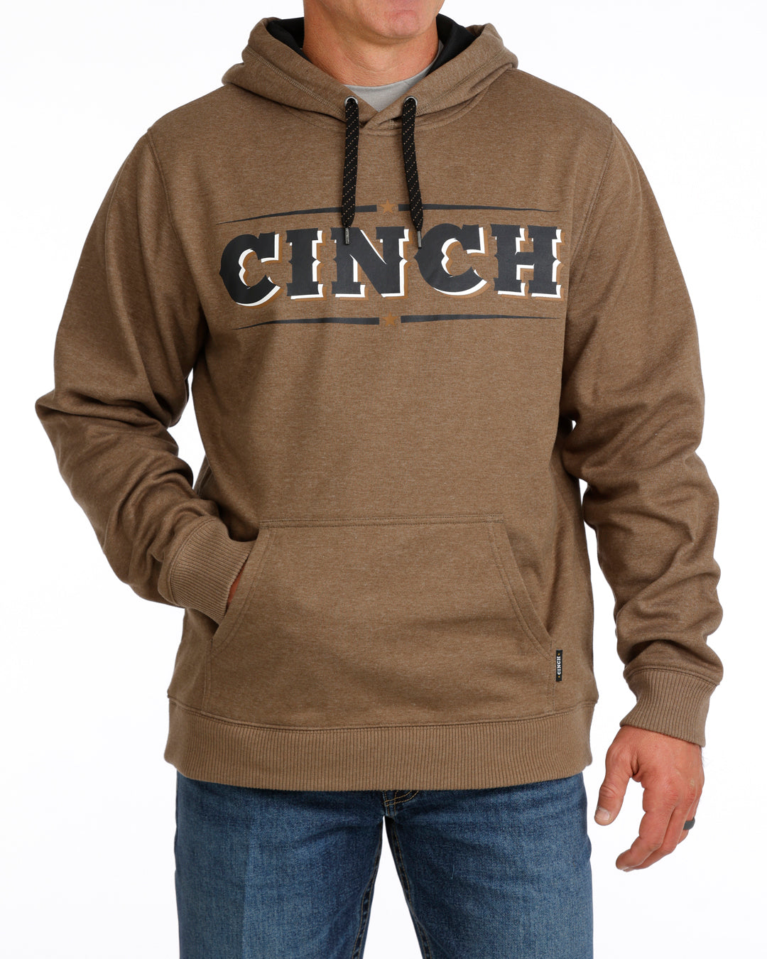 Brown hoodie with 'CINCH' logo worn by a person on a white background
