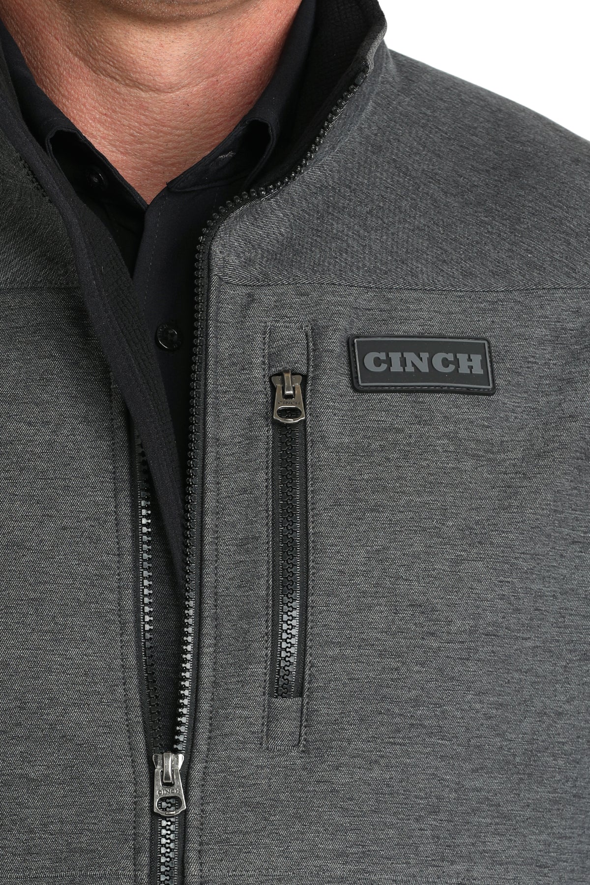 Man wearing Cinch vest on a white background