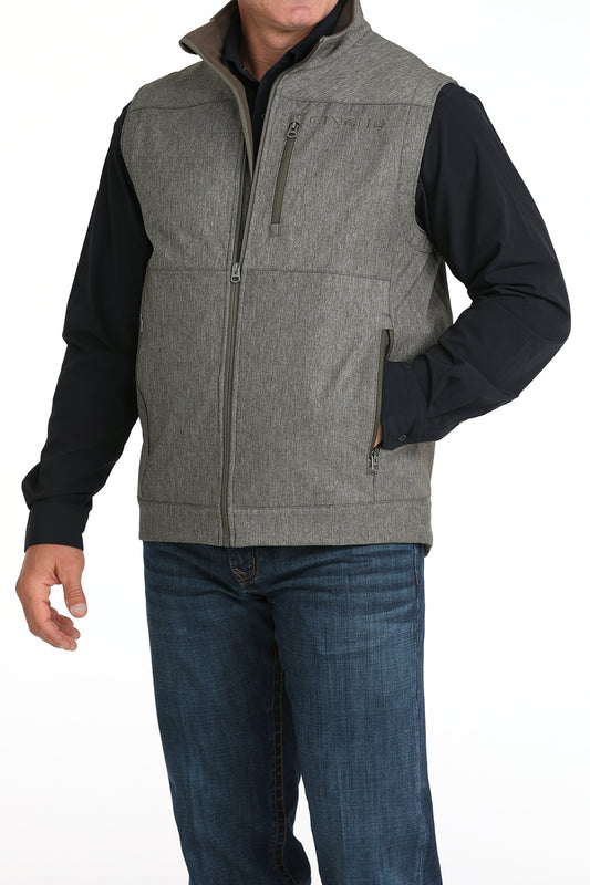 Man wearing Grey Cinch vest on a white background