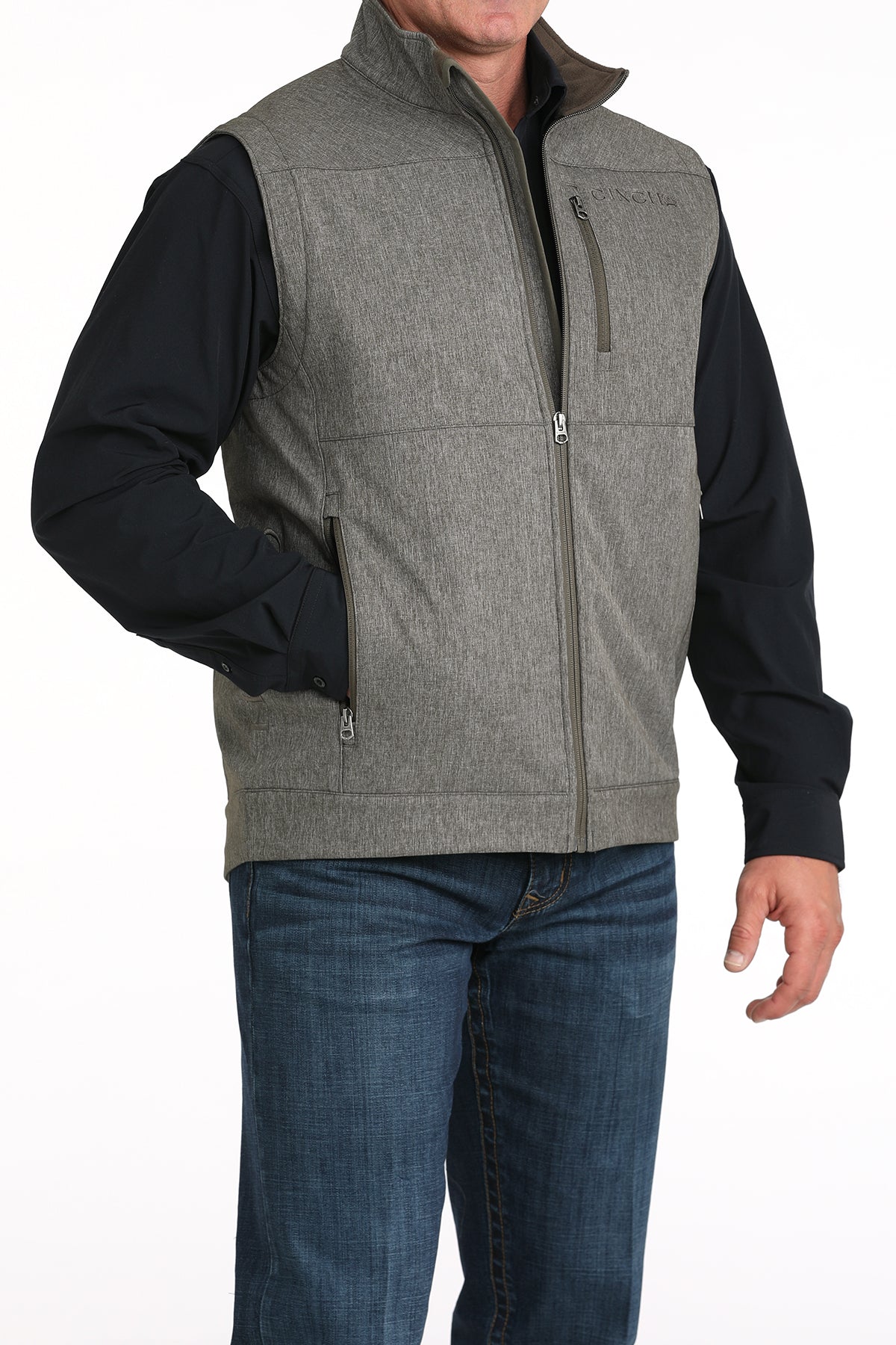 Man wearing Grey Cinch vest on a white background