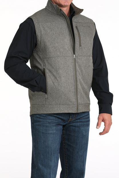 Man wearing Grey Cinch vest on a white background