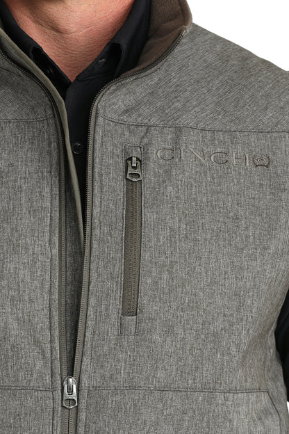 Man wearing Grey Cinch vest on a white background