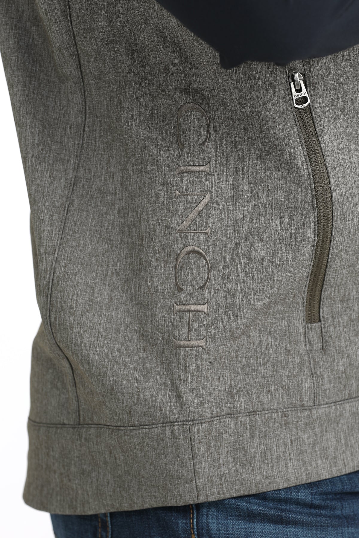 Man wearing Grey Cinch vest on a white background
