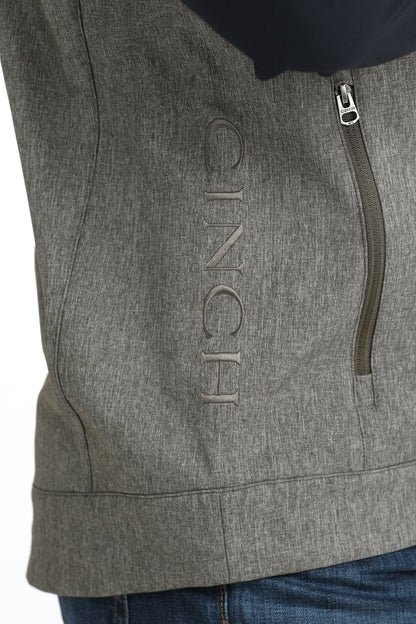 Man wearing Grey Cinch vest on a white background