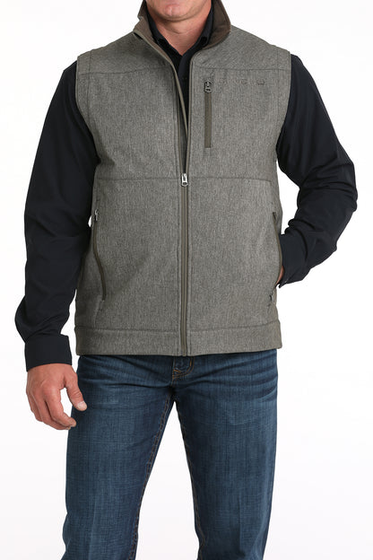 Man wearing Grey Cinch vest on a white background