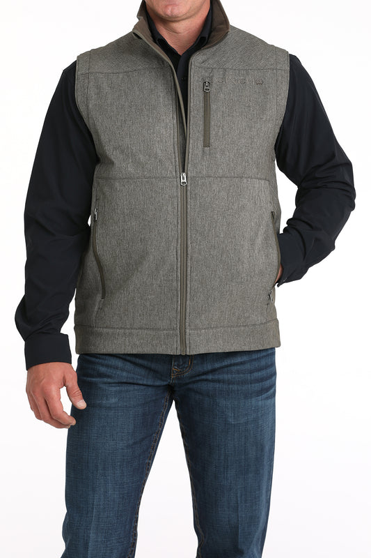 Man wearing Grey Cinch vest on a white background