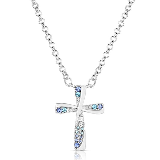 Montana Silversmiths Silver cross necklace with blue gemstones on a white background