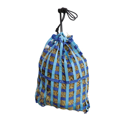 A blue and light blue netted hay bag filled with straw, suspended by a black rope handle against a plain white background.