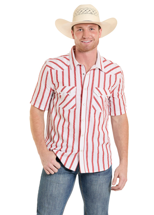 man wearing a red and white Panhandle Slim shirt with blue jeans and cowboy hat on a white background