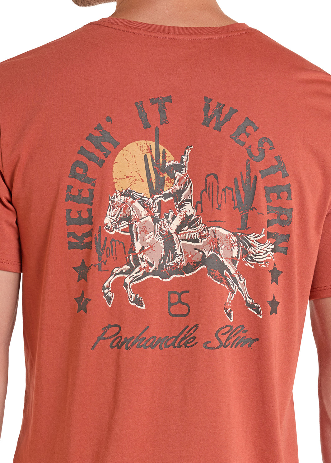 Rust Panhandle Slim t-shirt with a graphic of a person on a horse and text 'Keepin' It Western' on the back.