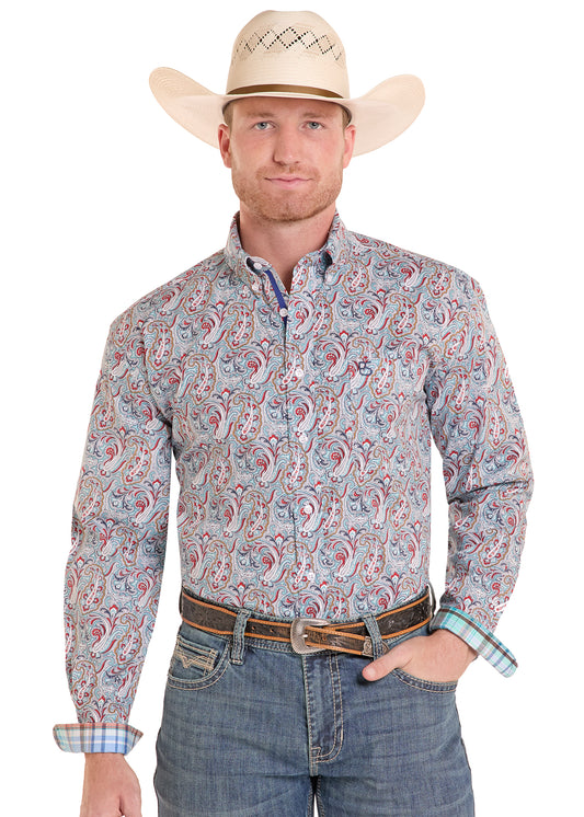 Man wearing a multi colored paisley Panhandle Slim shirt, blue jeans and a cowboy hat on a white background