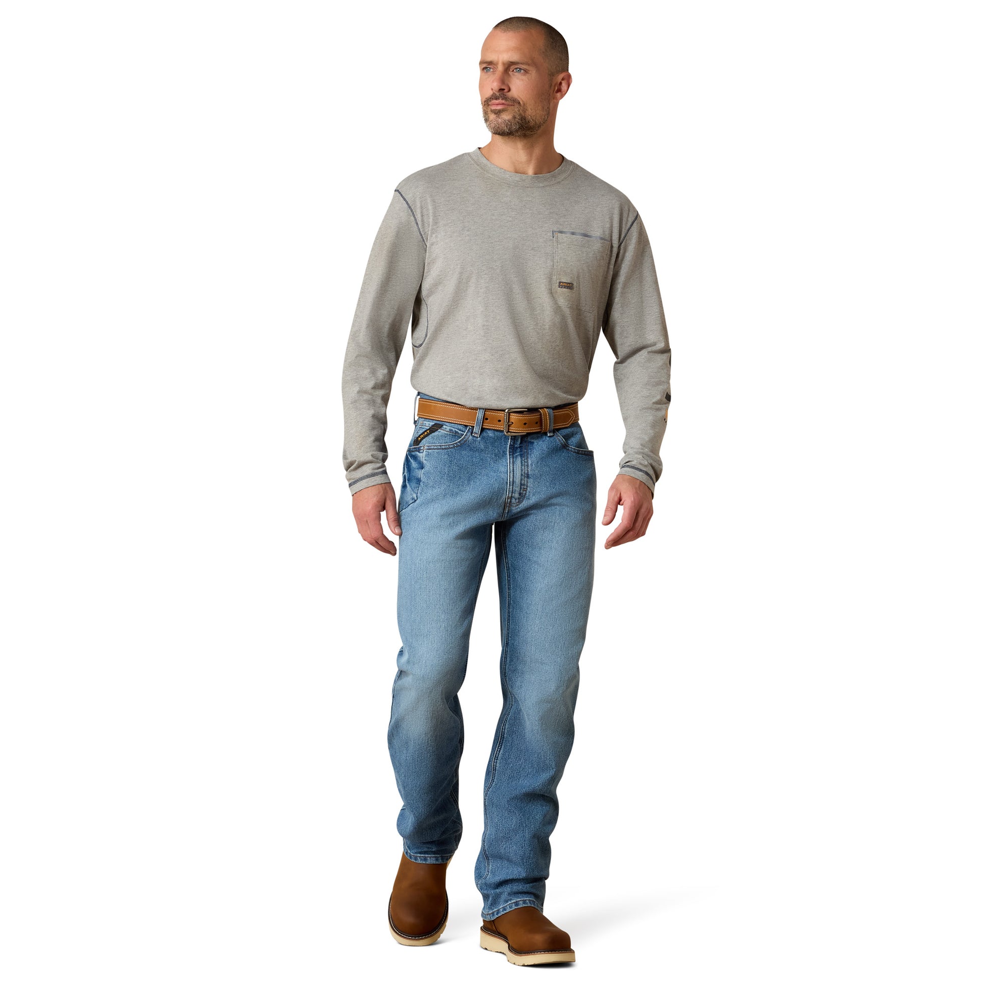man wearing Ariat jeans and a grey shirt on a white background