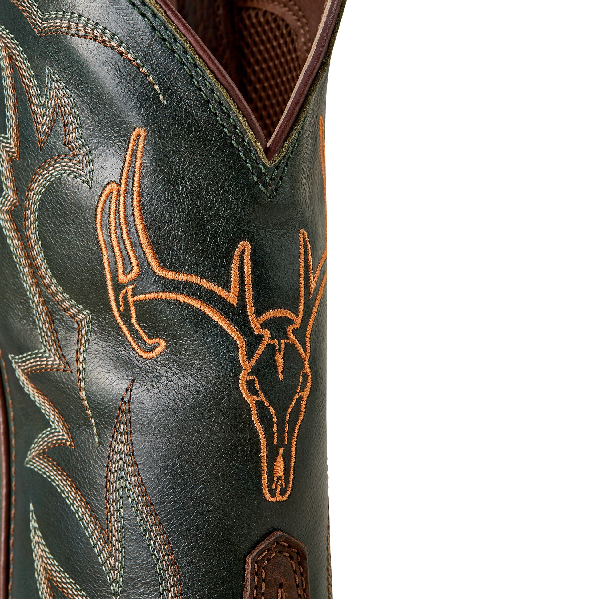 a close up of the shaft of a green cowboy boot with orange deer skull embroidery