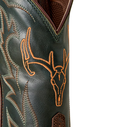 a close up of the shaft of a green cowboy boot with orange deer skull embroidery