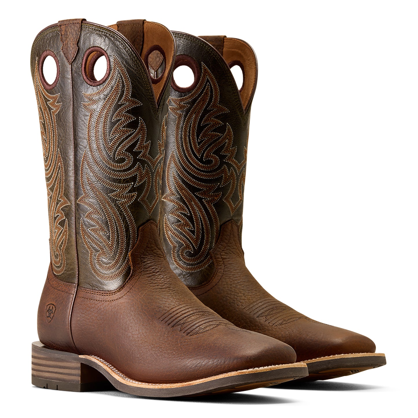 Pair of brown Ariat cowboy boots with intricate designs on a white background