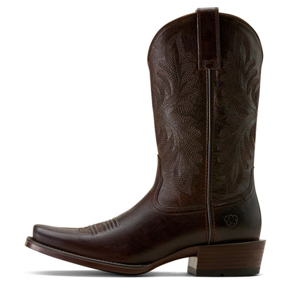 Brown ariat cowboy boot with intricate design on a white background