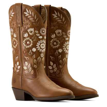 Brown Ariat cowboy boots with floral design on white background