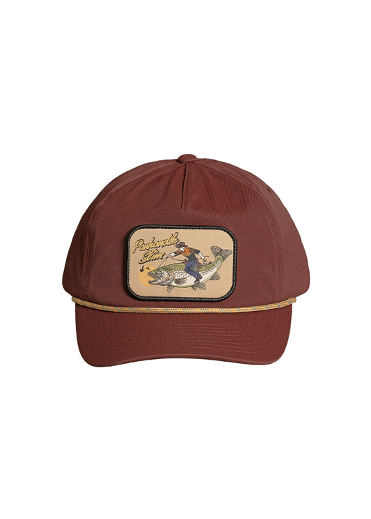 A maroon baseball cap featuring a rectangular embroidered patch on the front with a fisherman and the text Panhandle Slim.