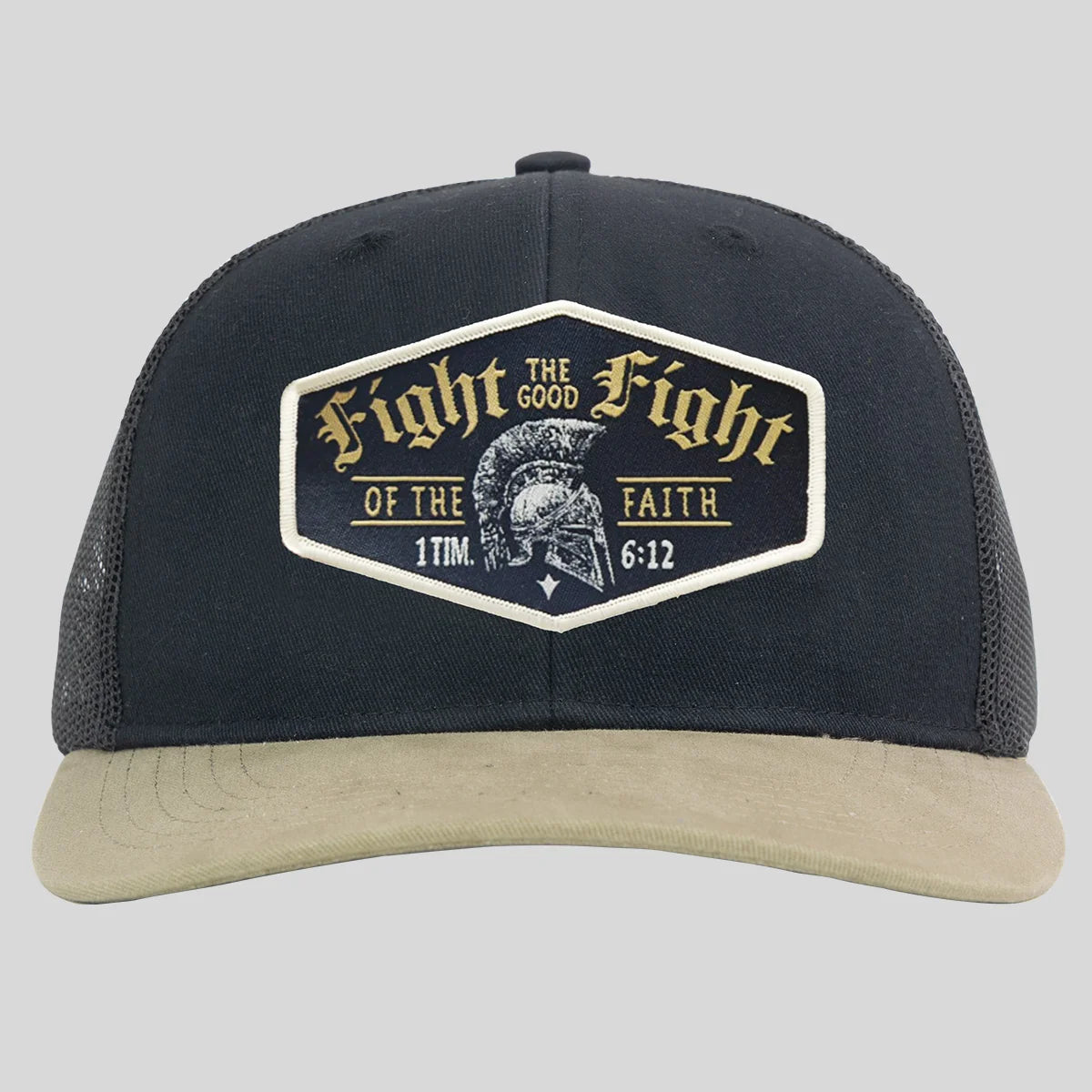 A black trucker hat from Kerusso with a beige curved brim and a large front patch that reads 'Fight the Good Fight of the Faith 1 Tim 6:12' with a Spartan helmet graphic.