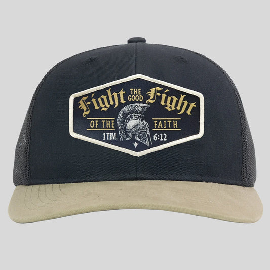 A black trucker hat from Kerusso with a beige curved brim and a large front patch that reads 'Fight the Good Fight of the Faith 1 Tim 6:12' with a Spartan helmet graphic.
