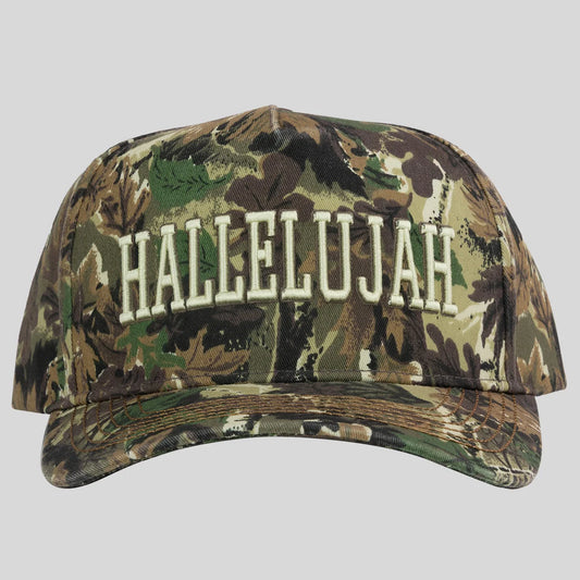 A baseball cap from Kerusso in a woodland camouflage pattern with 'HALLELUJAH' embroidered in white across the front, shown against a solid gray background.