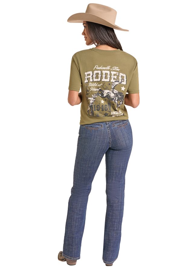 woman wearing an olive Panhandle Slim tshirt, blue jeans and a cream cowboy hat on a white background