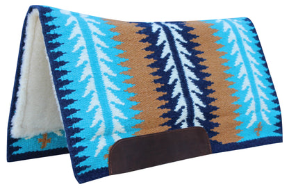 A western-style saddle pad with a Southwestern pattern featuring vertical stripes of turquoise, white, navy, and brown, with a white sherpa lining and a dark brown leather pad loop.