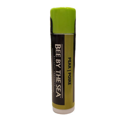 green lip balm tube on a white background