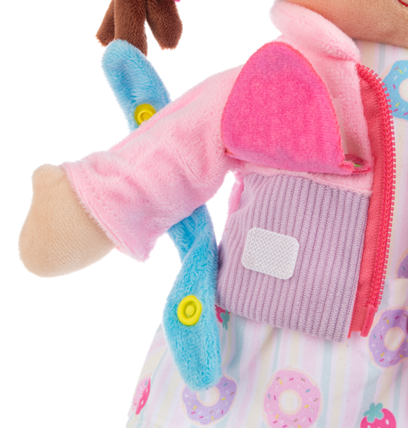 Close-up of a plush Ganz toy with pink arm and purple vest on a white background