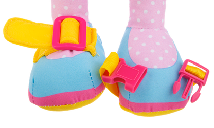 Colorful Ganz baby booties with polka dot design on a stuffed doll on a white background
