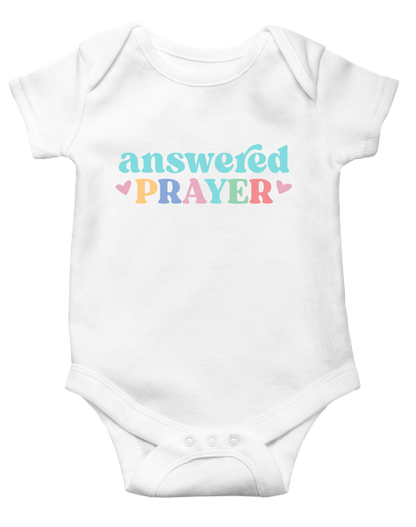 White Ganz baby onesie with 'answered prayer' text in colorful letters on a white background