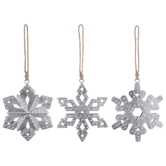 Three metal snowflake ornaments from Ganz on a white background