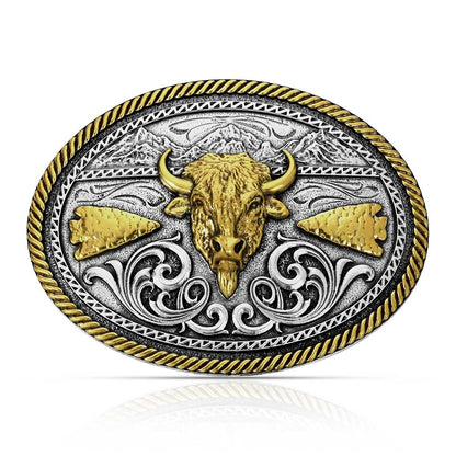 Montana Silversmiths Belt buckle with bull head design, gold and silver colors on a white background