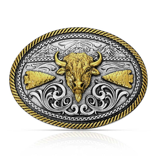Montana Silversmiths Belt buckle with bull head design, gold and silver colors on a white background